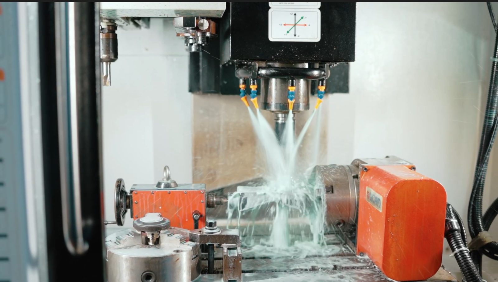 CNC machine cutting with coolant spray