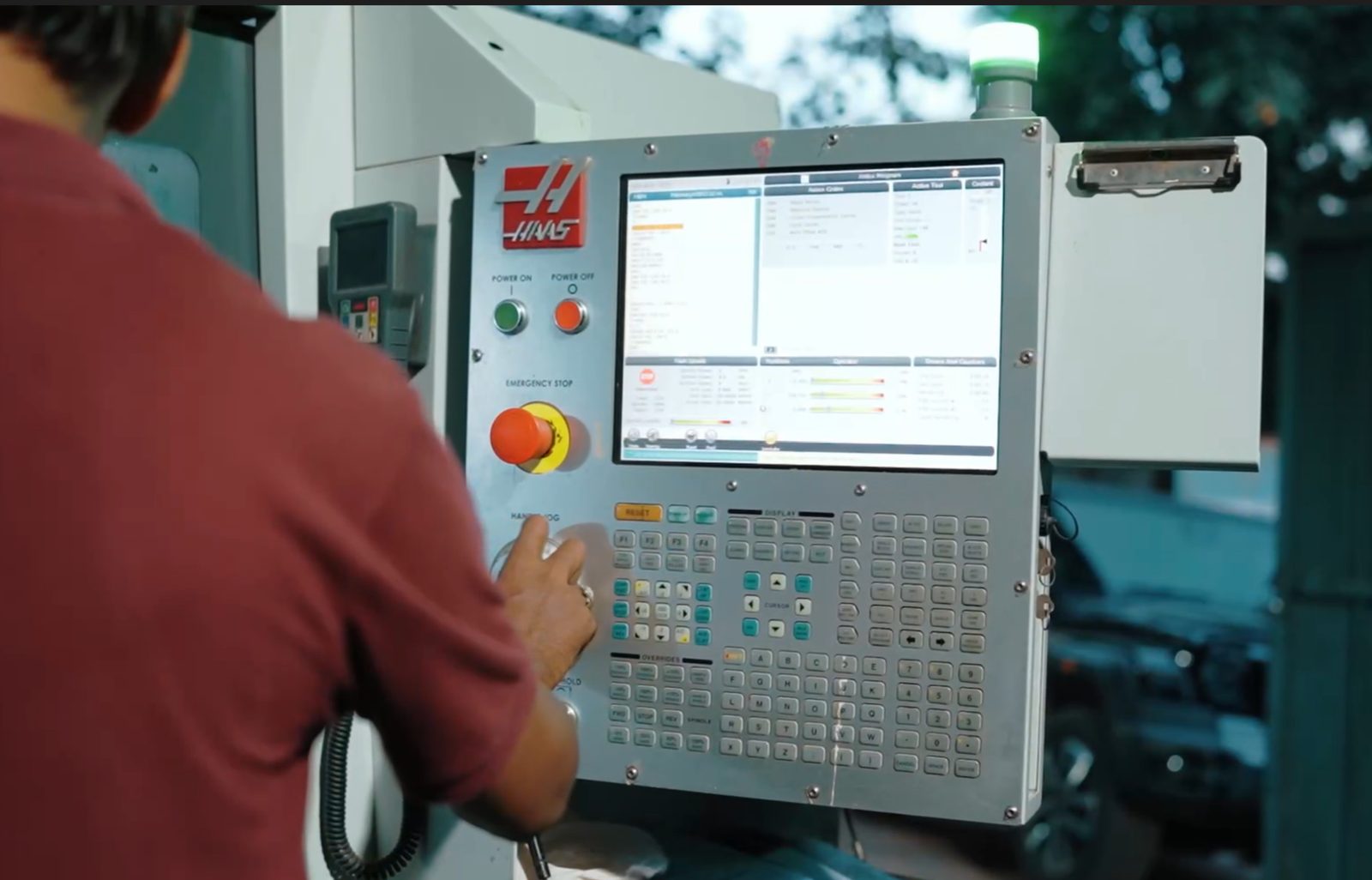 Operator running a CNC machining centre